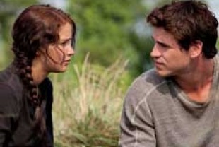 Jennifer Lawrence as Katniss and Liam Hemsworth as Gale