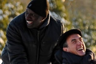 Omar Sy as Driss and Francois Cluzet as Philippe