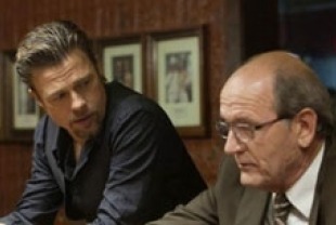 Brad Pitt as Jackie Cogan and Richard Jenkins as Driver