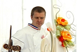 Chef Sebastien Canonne surveys Chef Jacquy Pfeiffer's final buffet