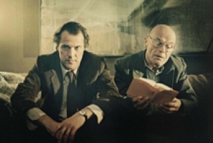 Sebastian Koch as Dreyman visiting with Volkmar Kleinert as Jerska