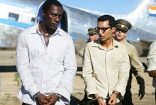 Idris Elba as Mandela and Riaad Moosa as Ahmed