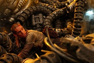 Clayton Watson as the Kid fighting the machines