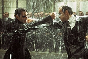 Keanu Reeves as Neo and Hugo Weaving as Mr. Smith