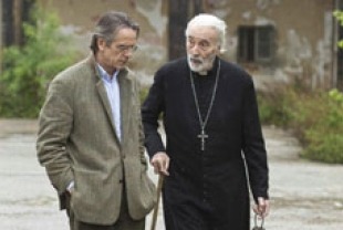 Jeremy Irons as Raimund and Christopher Lee as Father Bartholomeu