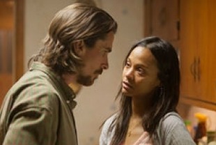 Christian Bale as Russell and Zoe Saldana as Lena