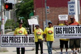 Protesters in Newark, N.J., protest high gas prices in 2011. The price of gas closely tracks with the unemployment rate during economic downturns - High prices put pressure on working families and businesses that rely on the transport of goods. 