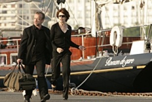 Fanny Ardant as Judith and Dominique Pinon as the Stranger