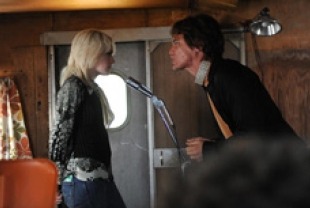Dakota Fanning as Cherrie Currie and Michael Shannon as Kim Fowley