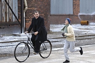 Campbell Scott as Father Hibbert and Adam Butcher as Ralph