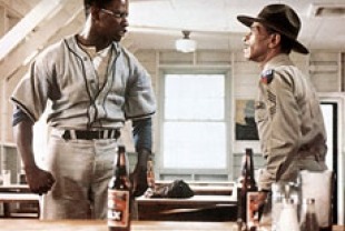 Denzel Washington as Private Melvin and Aldoph Ceasar as Sergeant Vernon
