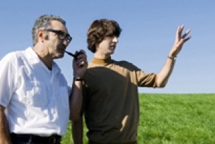 Eugene Levy as Max Yasgur and Demetri Martin as Elliot
