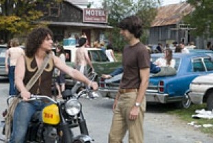 Jonathan Groff as Michael Lang and Demetri Martin as Elliot