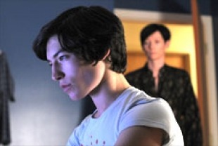 Ezra Miller as Kevin and Tildon Swinton as Eva