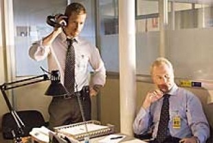 Guy Pearce as Roy Clayton and Neal McDonough as Max Archer