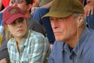 Amy Adams as Mickey and Clint Eastwood as Gus
