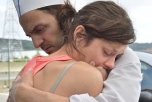 Fabrizio Rongione as Manu and Marion Cotillard as Sandra