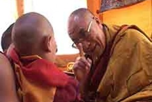 The Child with His Holiness the Dalai Lama