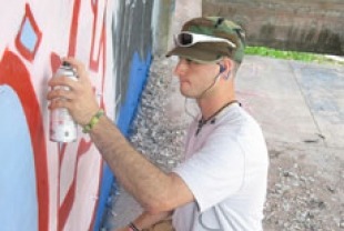 Dom sprays love mural